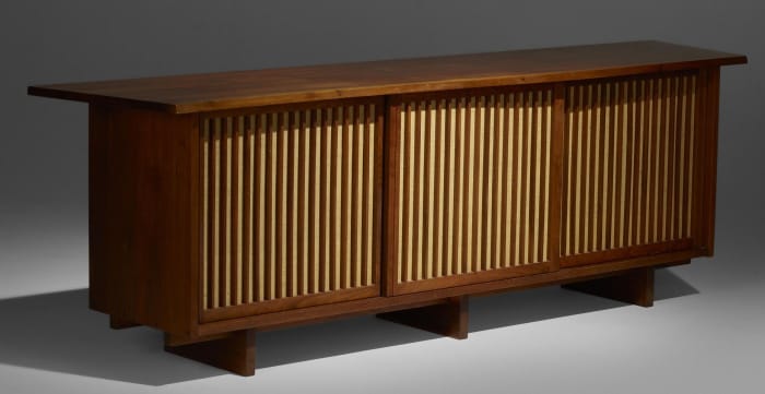 George Nakashima, triple-sliding-door cabinet, American black walnut and pandanus cloth, 1967. Sold by Rago Auctions through LiveAuctioneers for $45,500.