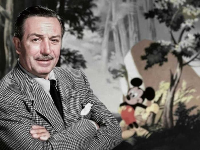 Walt Disney with Mickey Mouse, the character who started it all.