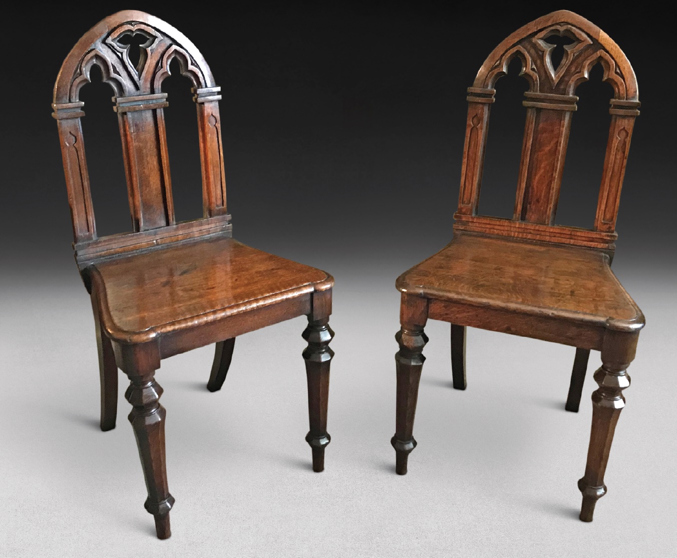 A pair of gothic hall chairs