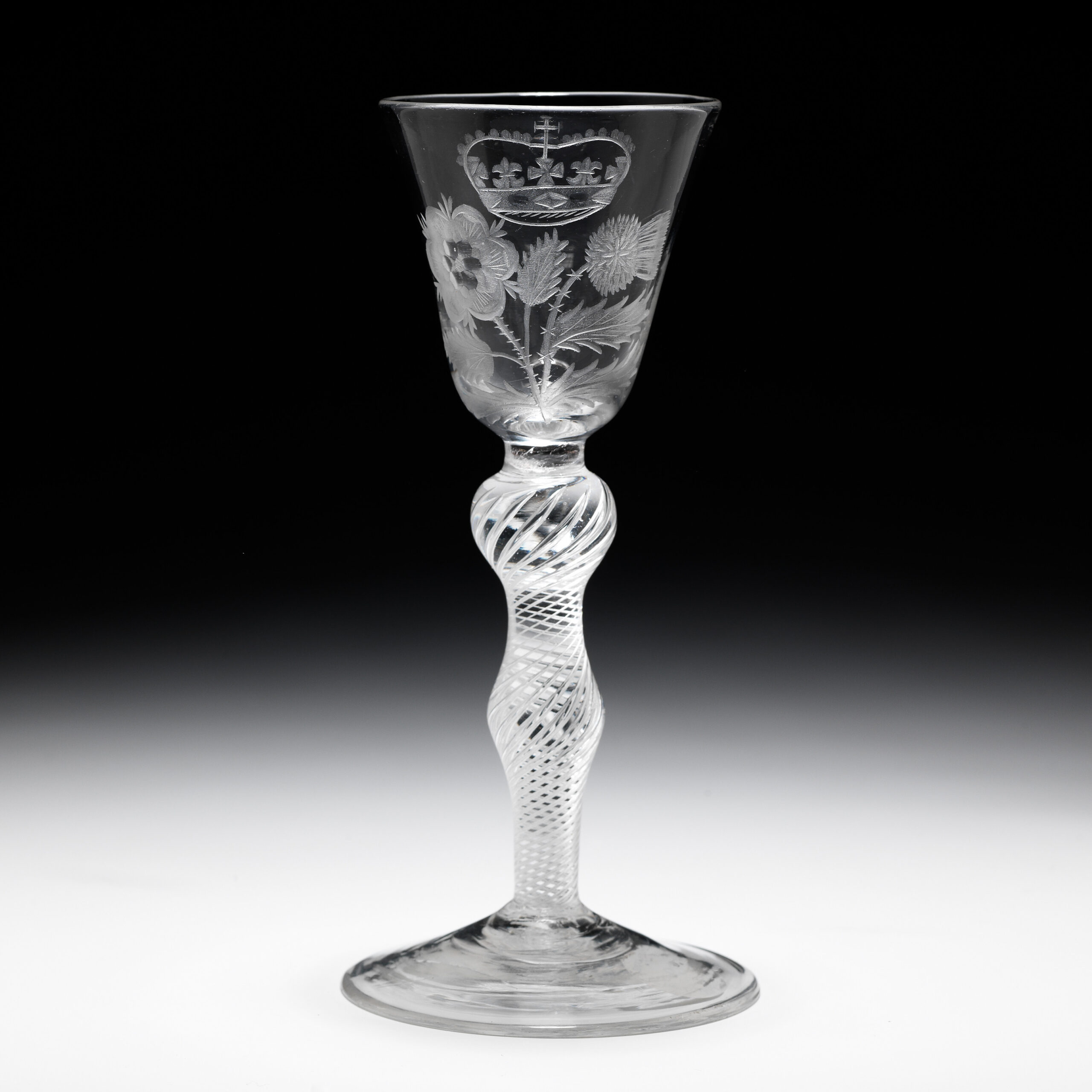 A rare, engraved Jacobite airtwist wine glass (crown thistle rose) circa 1750