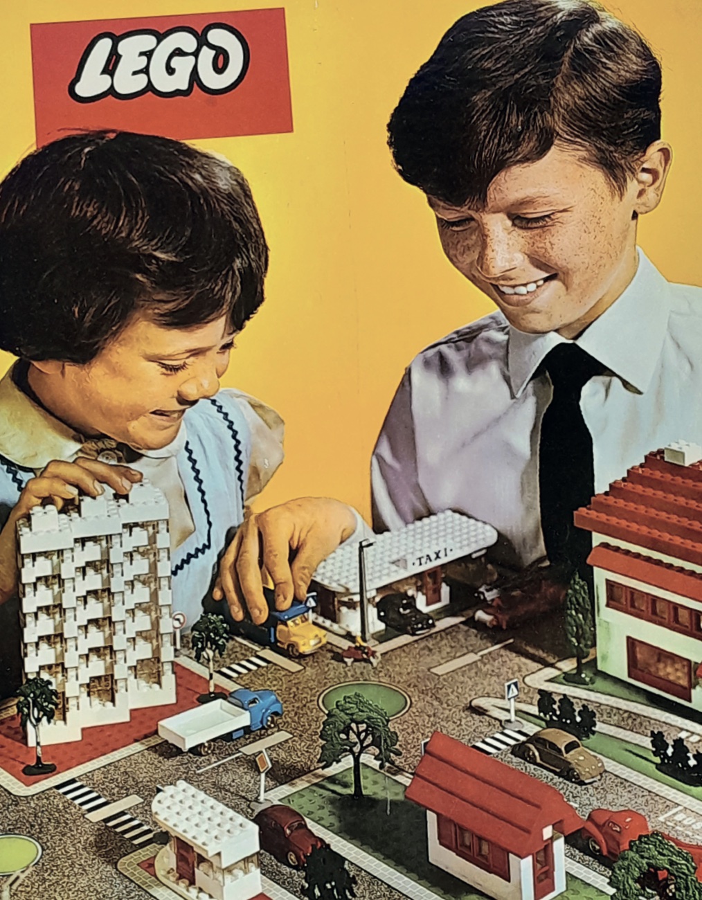 A vintage advert for Lego with two children playing