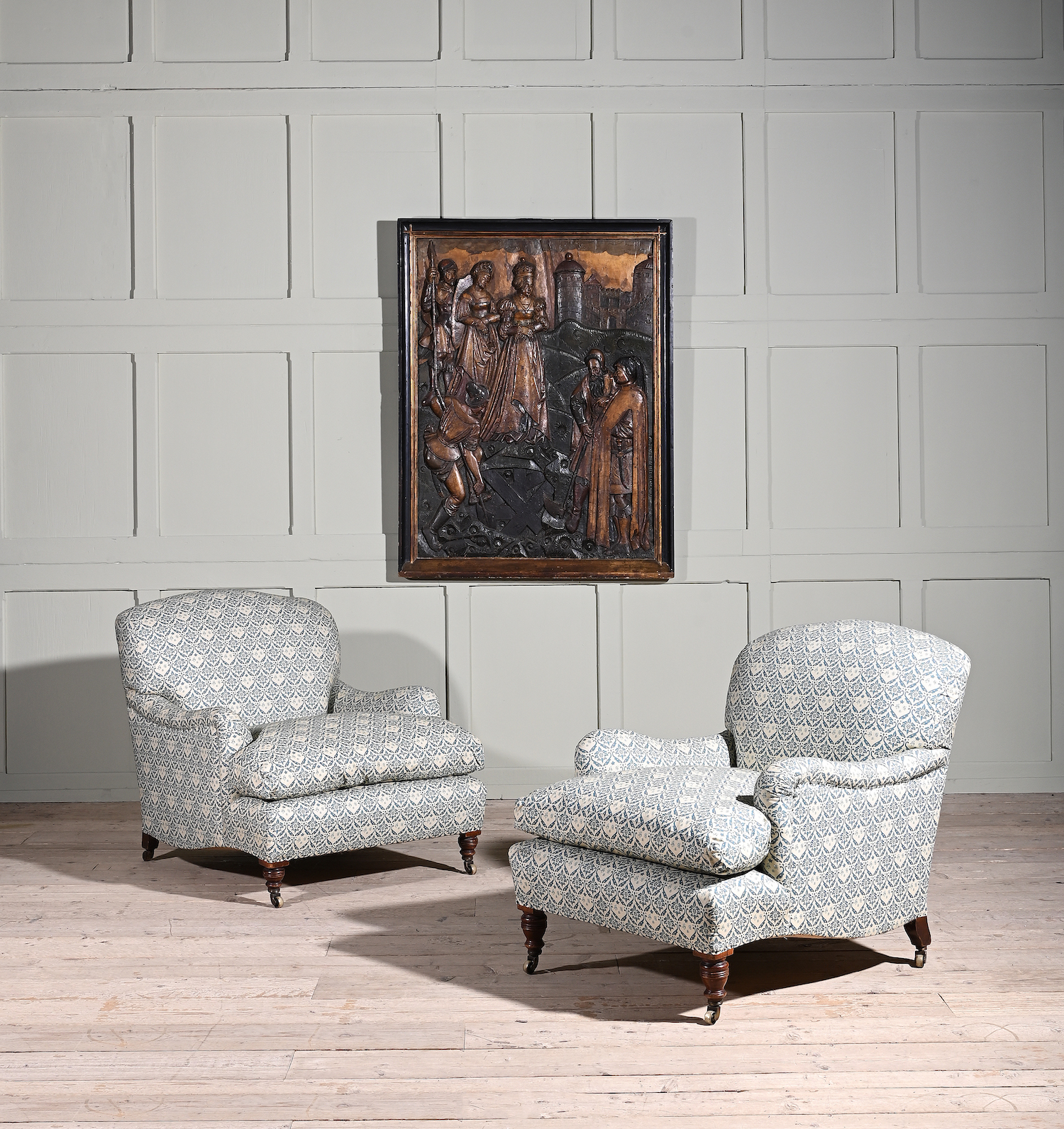 A matched pair of walnut and upholstered Bridgewater & Grafton armchairs by Howard and Son