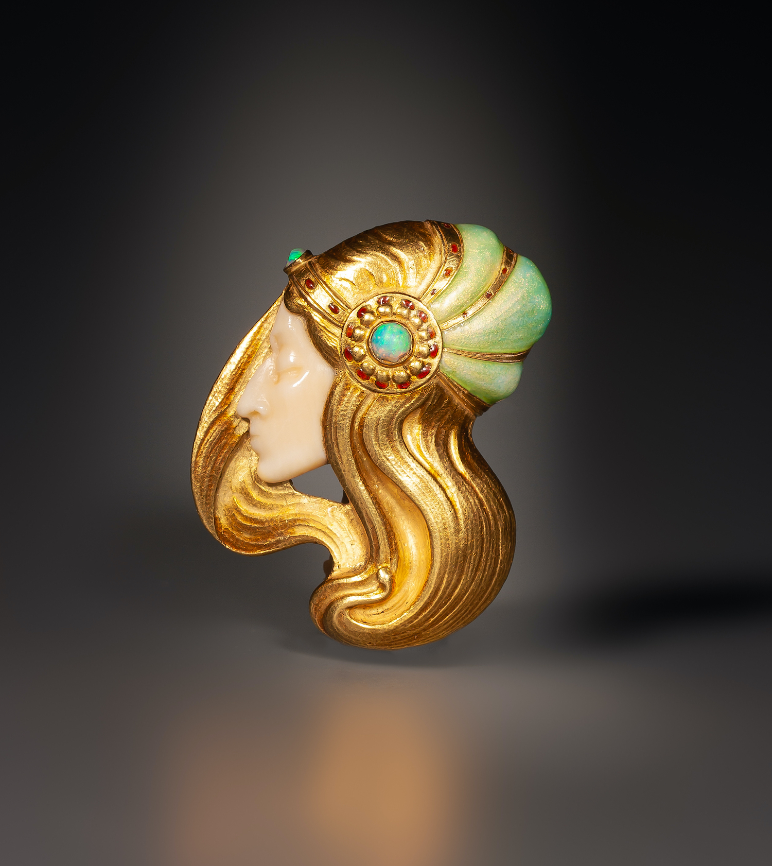 An Art Nouveau gold, ivory, opal and enamel brooch by Marcel Bing