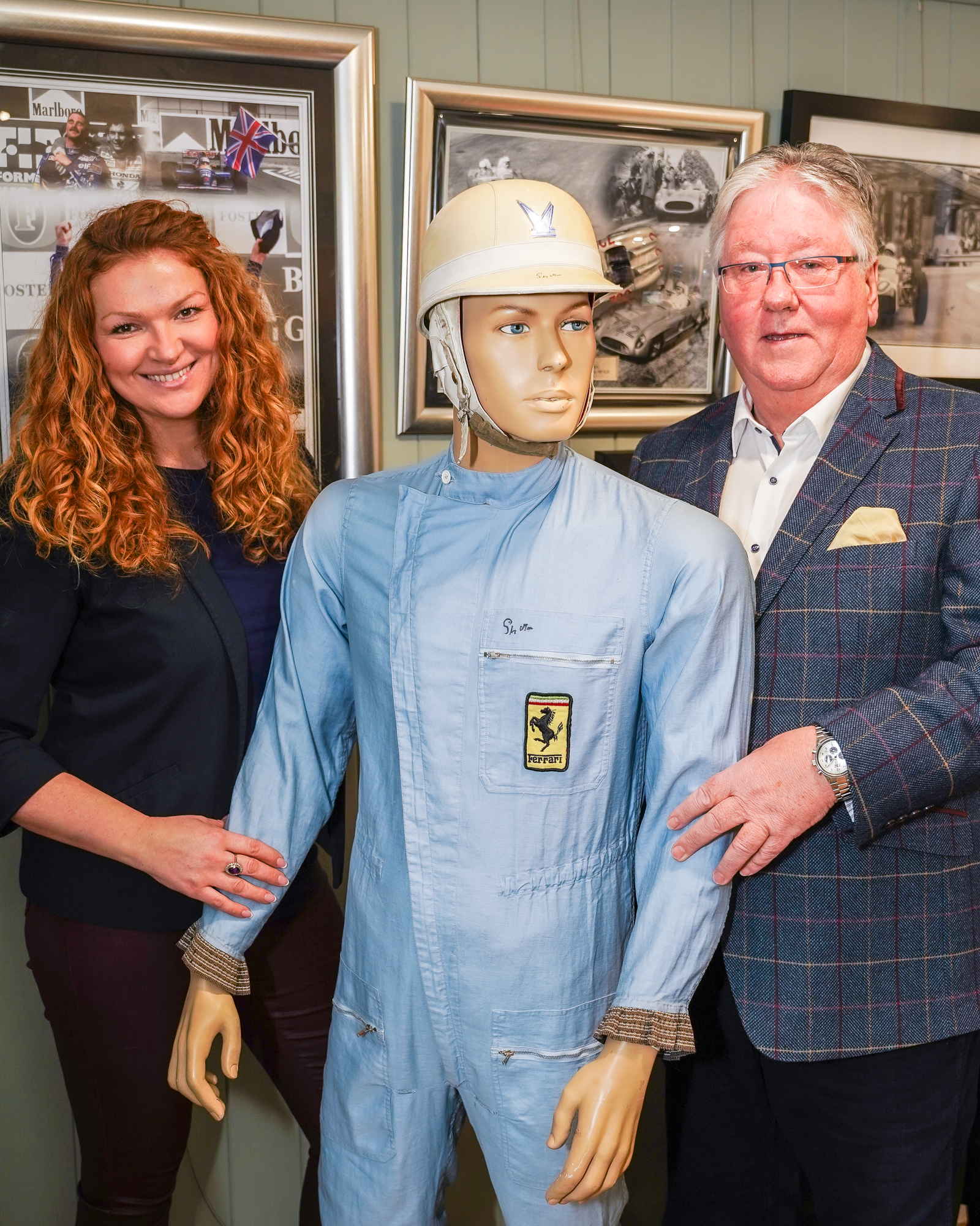 Auction house owner Irita Marriott with Rob Arnold, owner of the Sir Stirling Moss race suit