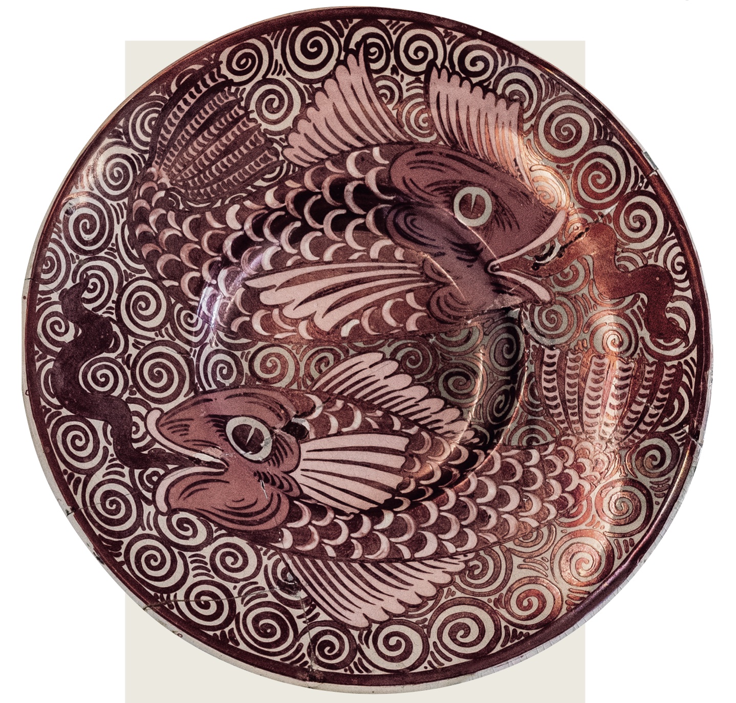 An antique ceramic plated designed by William de Morgan