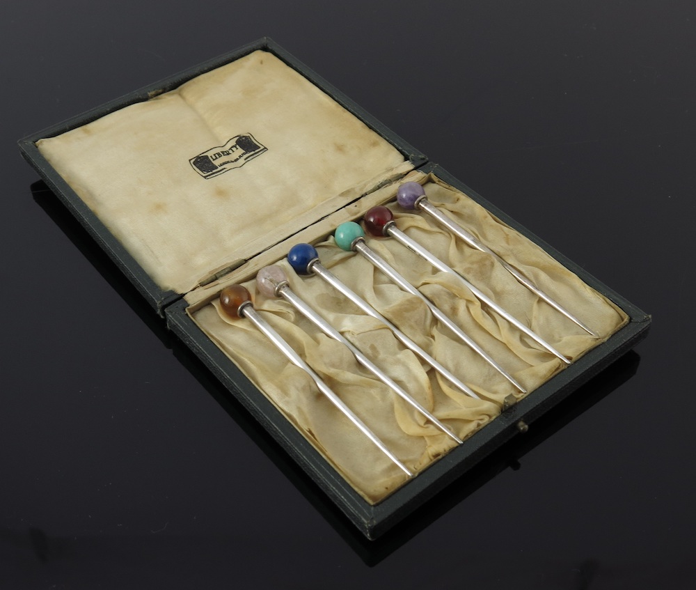 A set of cocktail sticks by Liberty and Co. Ltd.