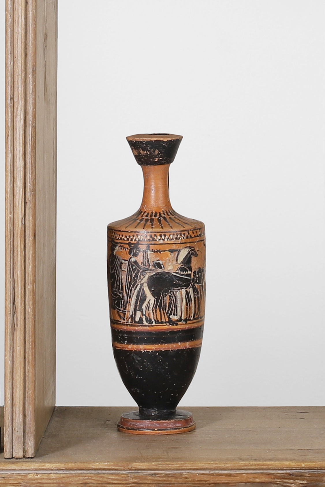 An ancient Greek black-figure lekythos vessel