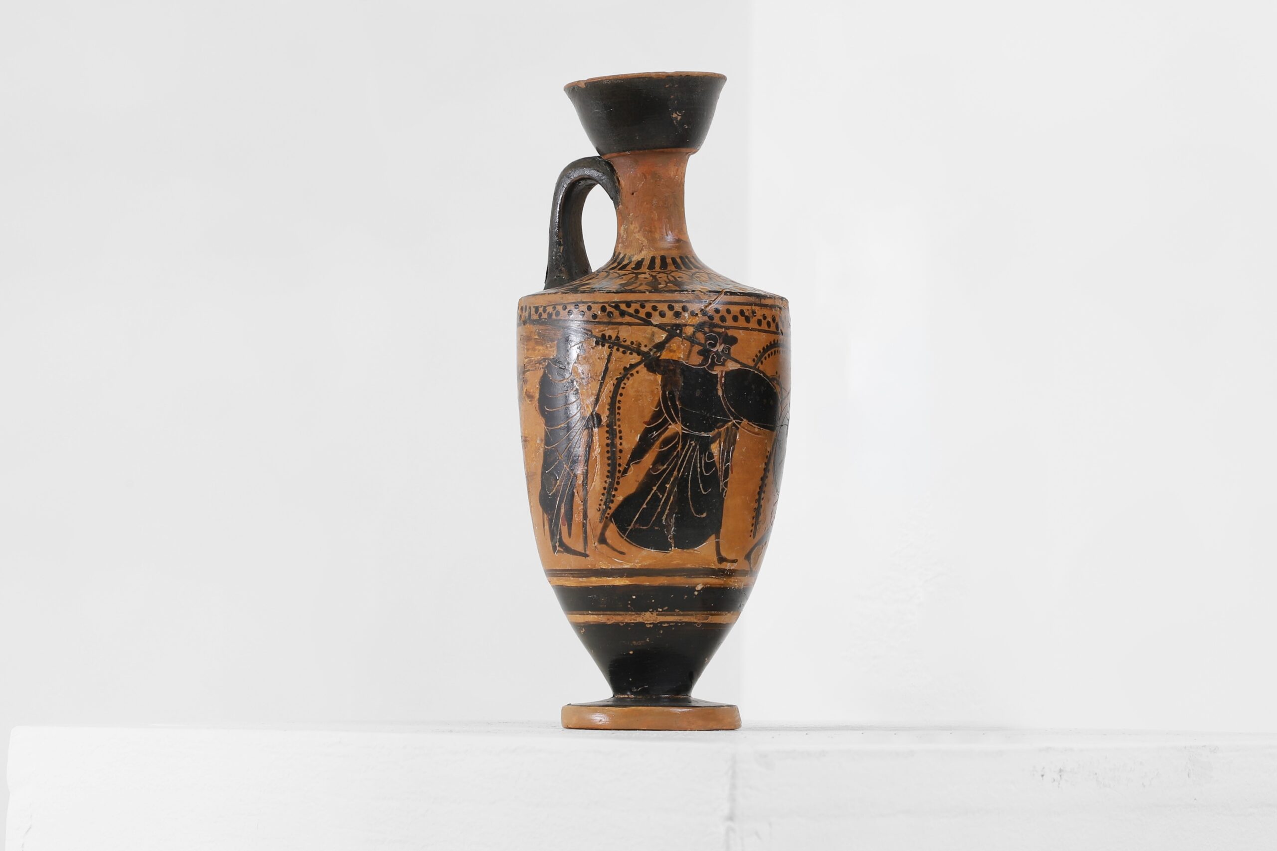 An antique Greek lekythos vessel decorated with Athena