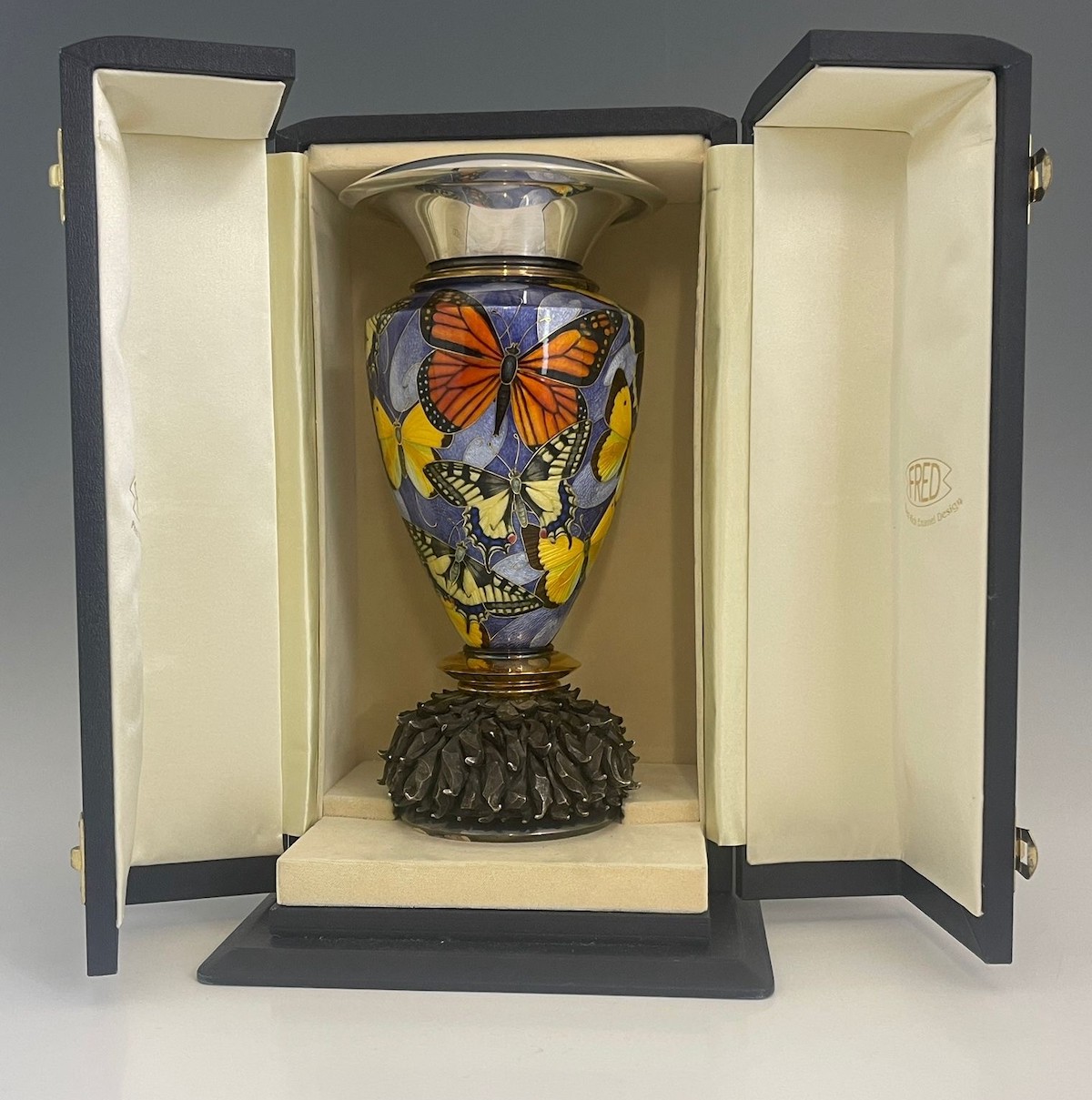 A silver and enamel butterfly vase by goldsmith Fred Rich