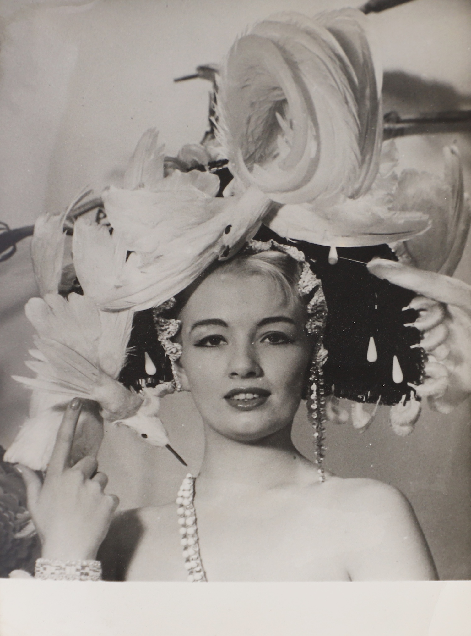 A rare press photograph of Christine Keeler, 1961, French, with Keeler wearing a Michael Bronze showgirl costume for Murray's Cabaret Club