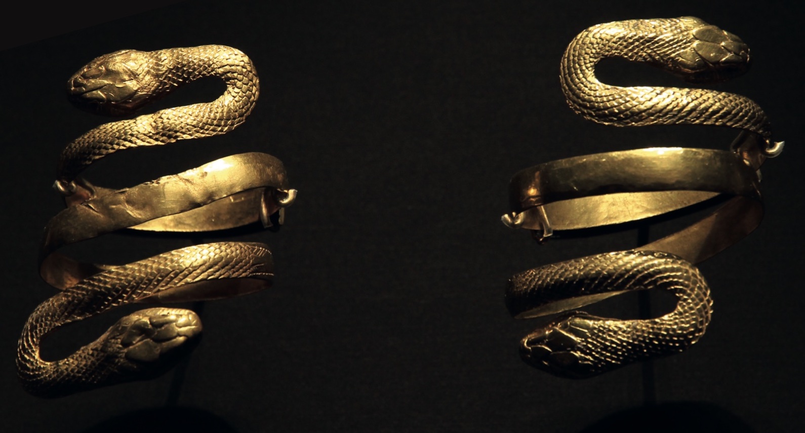 Two snake armlets, gold with green glass, Roman Empire (probably Egypt), 1st century AD. Formerlyin Castellani collection