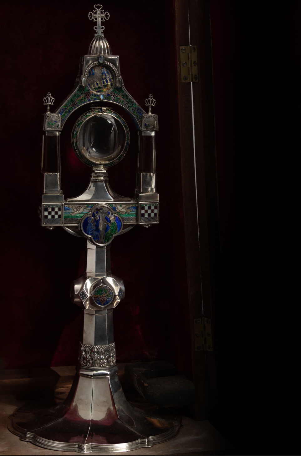 A silver and enamel monstrance in the Arts and Crafts style