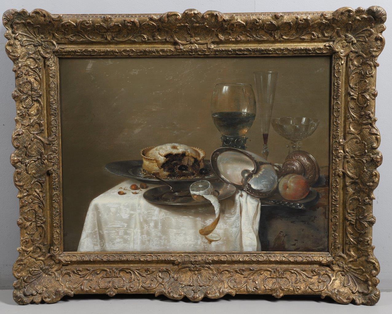 still life of a cut pie with a lemon, glassware and a nautilus shell upon a dish ascribed to the Dutch master Willem Claesz. Heda