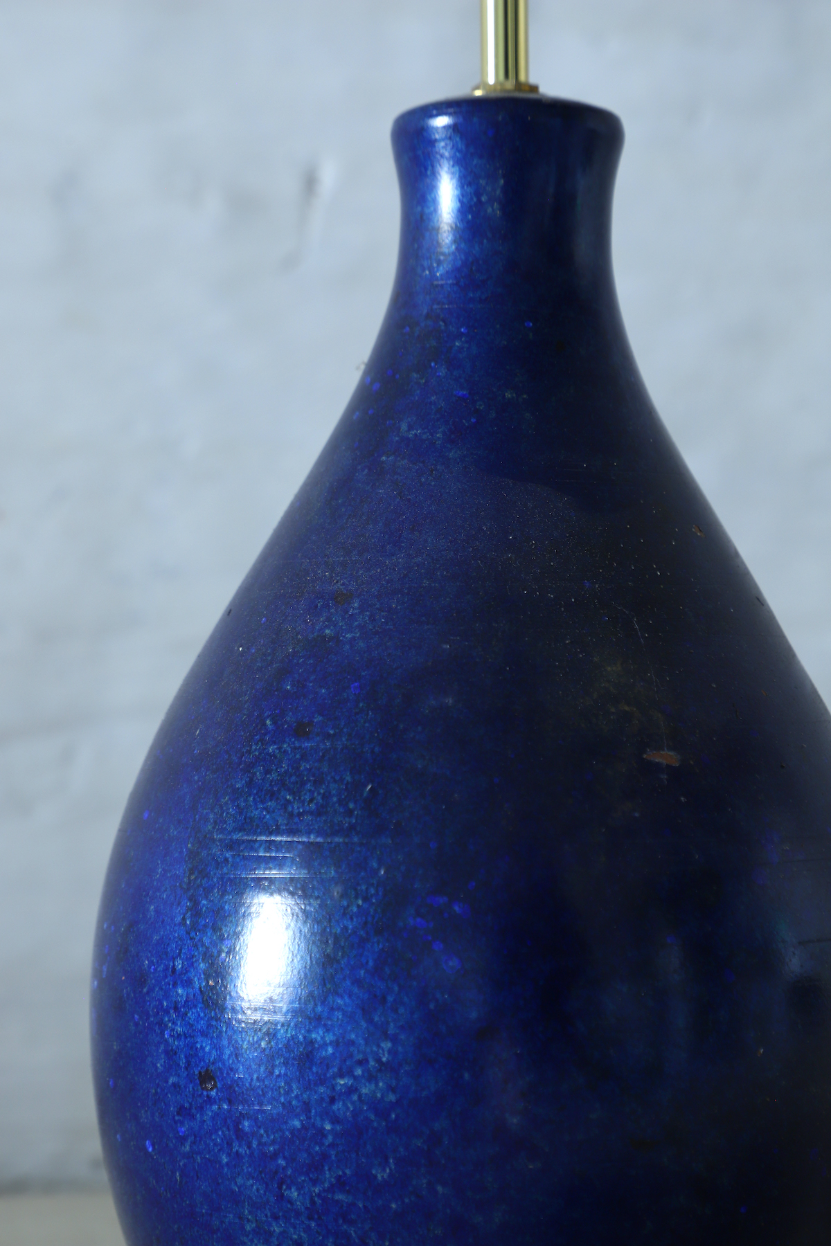 An antique table lamp with lapis lazuli glaze