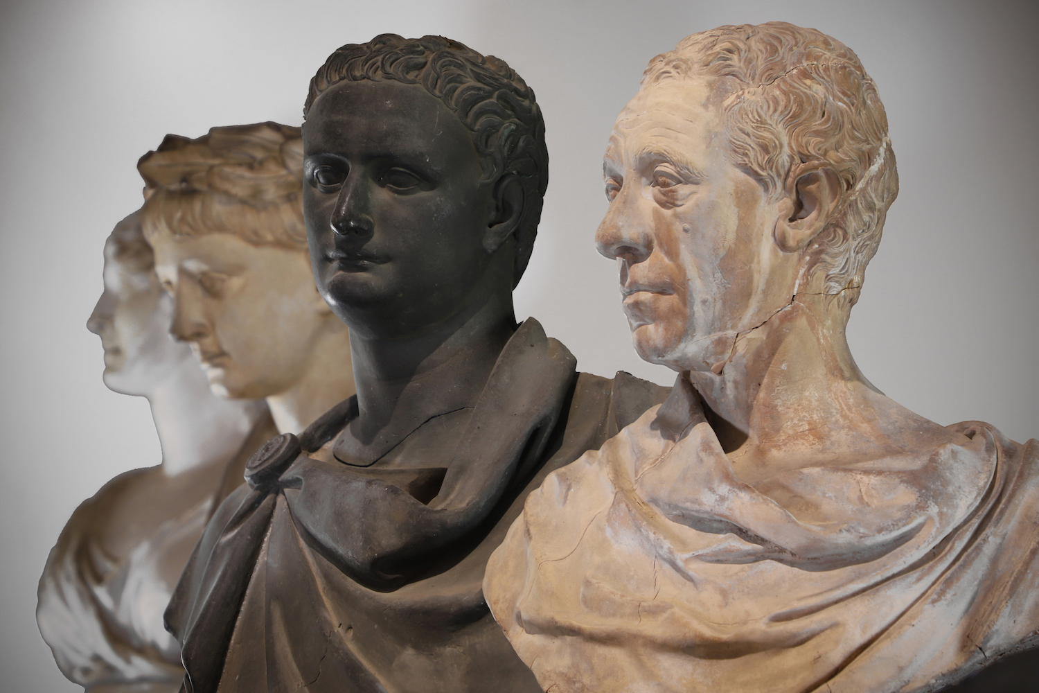 A selection of 18th and 19th-century busts in bronze, terracotta and plaster depicting extended members of the Coke family of Holkham Hall and faces from classical Rome and Greece