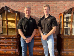 Two young antique dealers