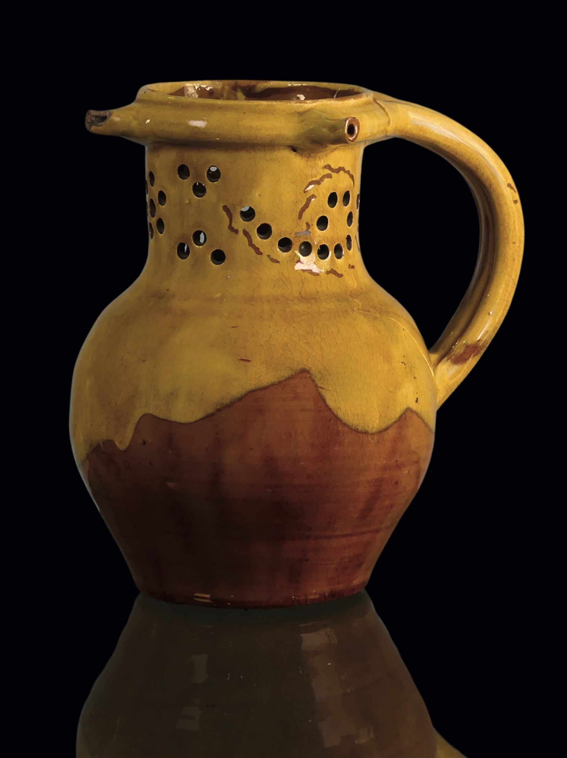 A Fishley Potter puzzle jug