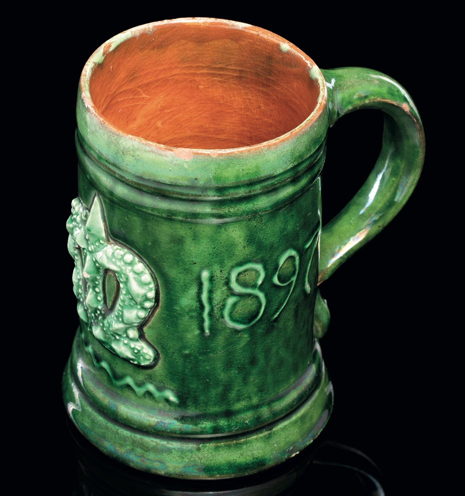 A Fremington Pottery mug, celebrating Queen Victoria’s Diamond Jubilee, by Edwin Beer Fishley