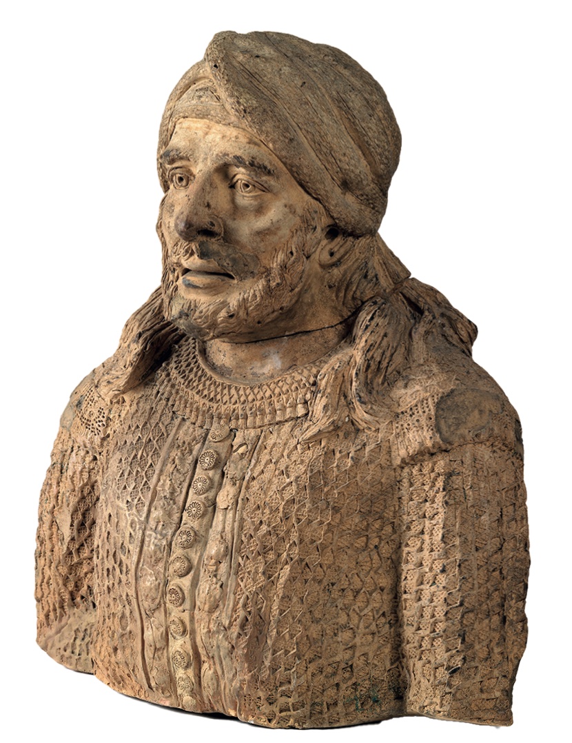 An antique terracotta bust of a Moroccan man 